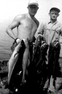 Clyde Roper, Ph.D., left, and Rye fisherman Herbert Drake. Former Rye fisherman Roper is the world’s authority on giant squid. (Clyde Roper)