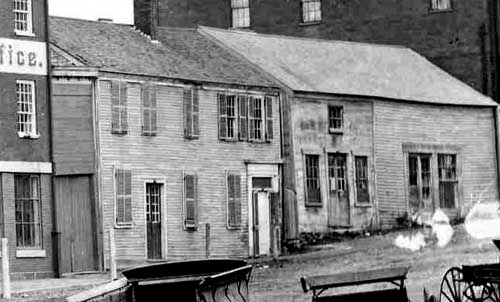 Wooden buildings no lionger standing on Bow Street, circa 1881 / Strawbery Banke Archive